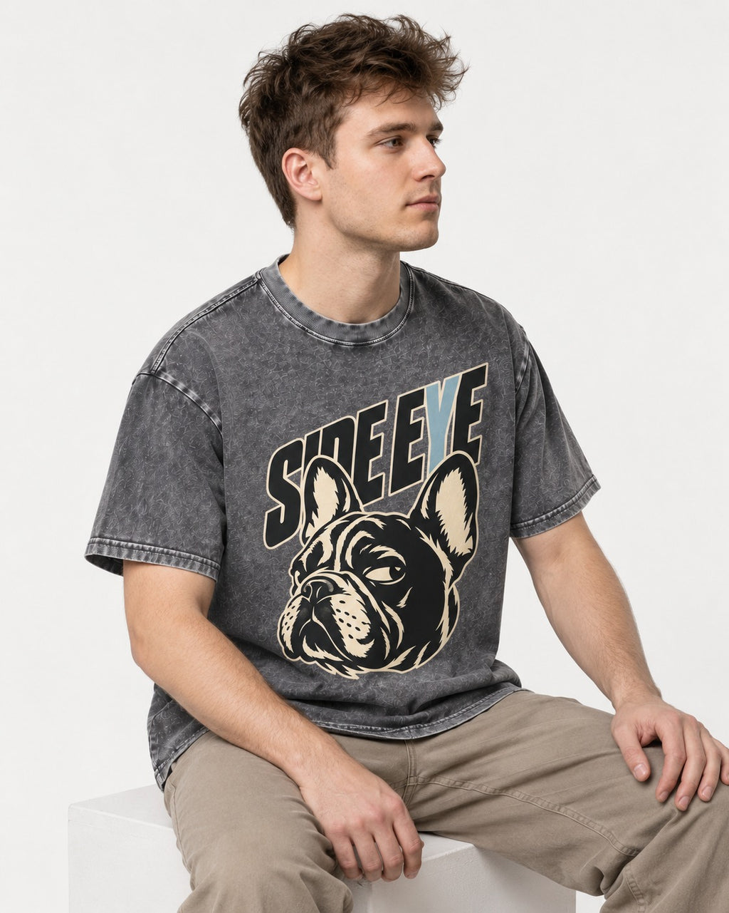 Frenchie Side Eye Portrait Graphic Washed Tee in Gray, worn by a seated model