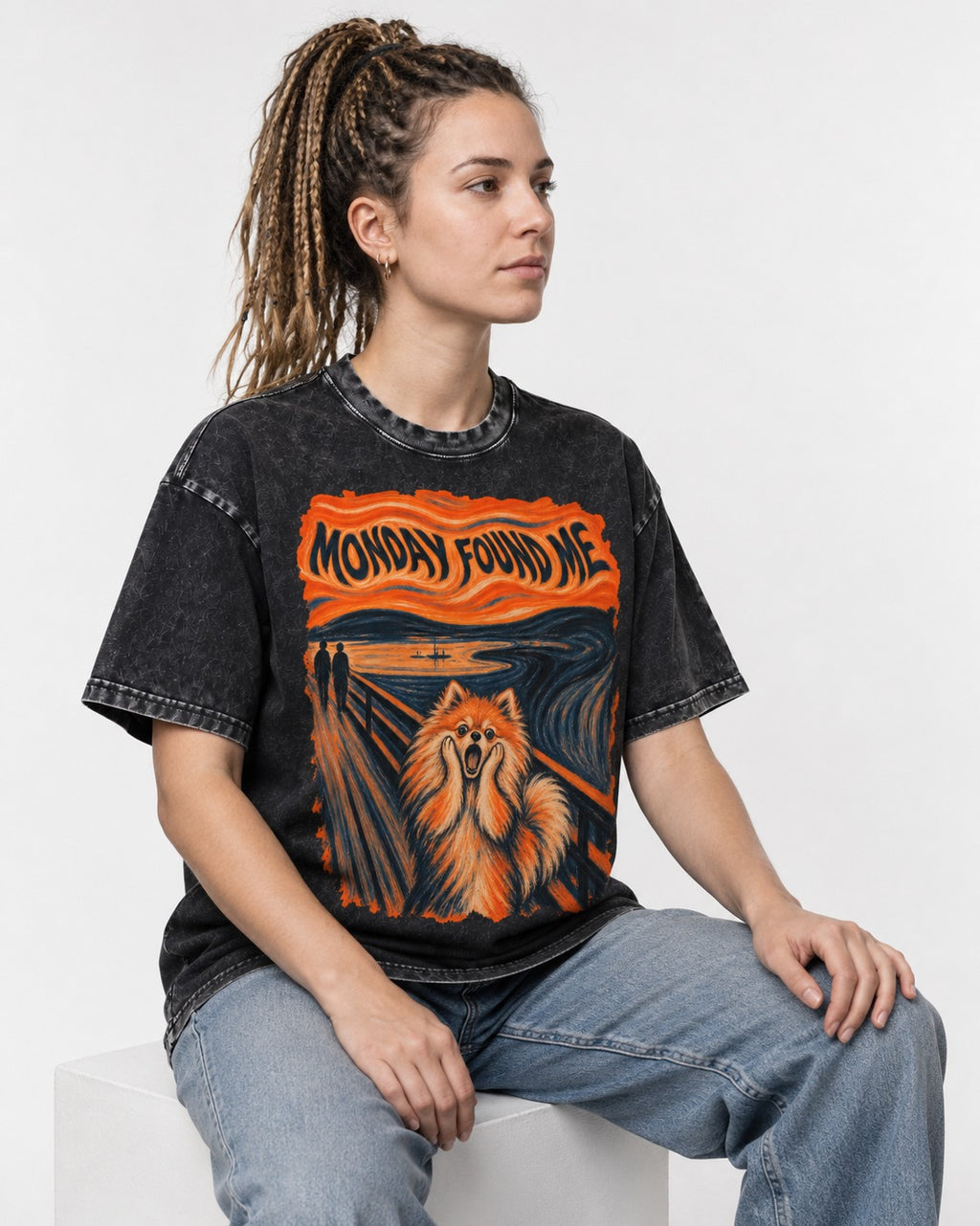 Pomeranian Monday Found Me Scream Parody Graphic Washed Tee in Black, worn by a seated model