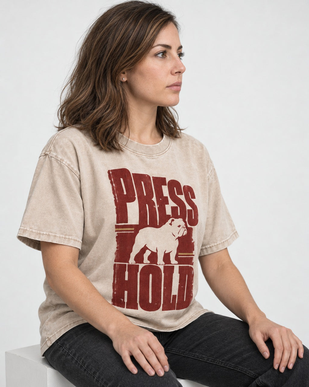 English Bulldog Press and Hold Washed Tee in Apricot, worn by a seated model