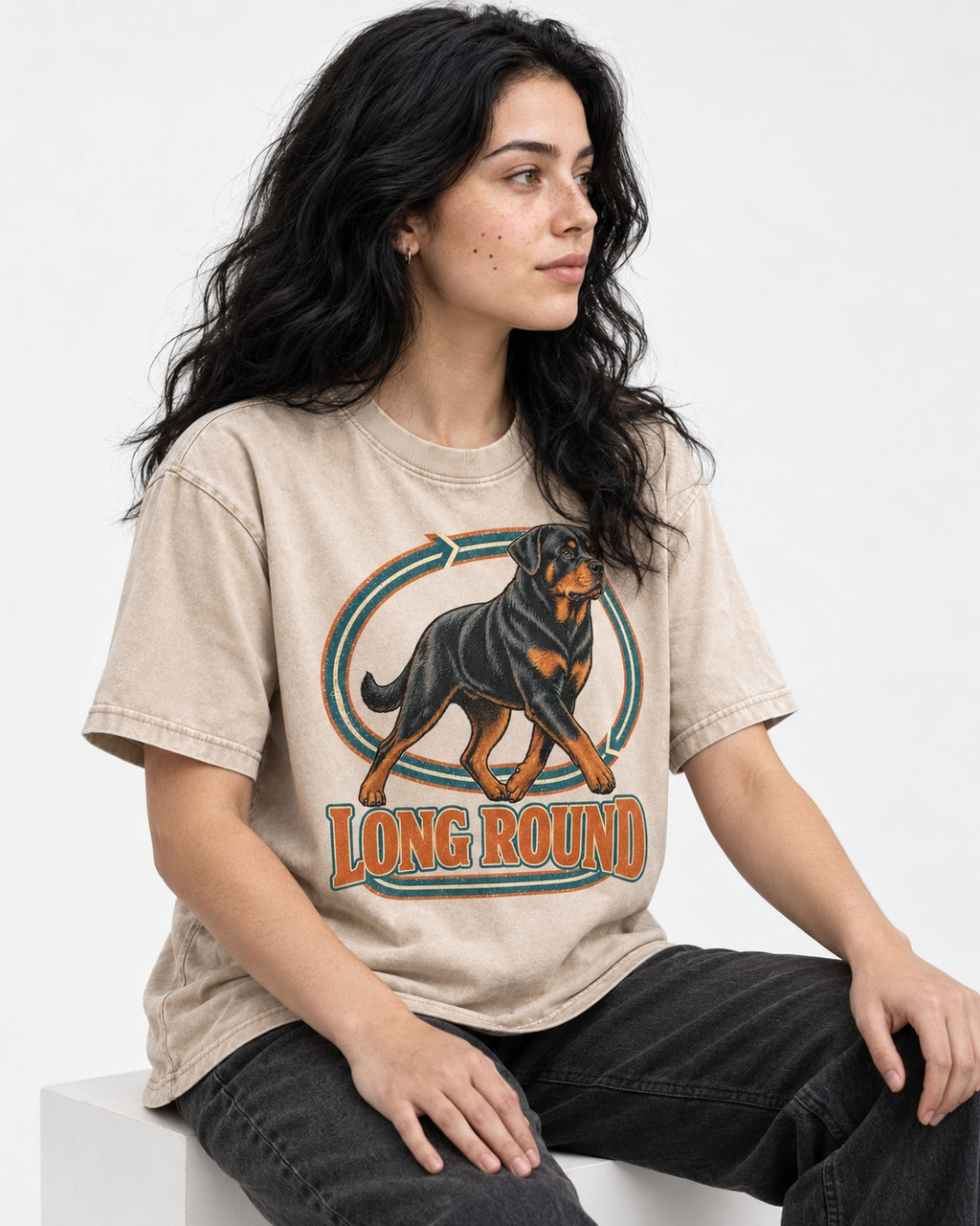 Rottweiler Long Round Circular Track Graphic Washed Tee in Apricot, worn by a seated model