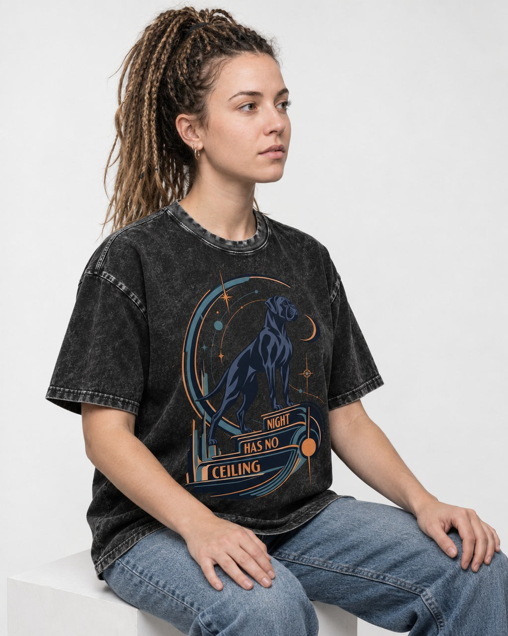 Night Has No Ceiling Boxer Cosmic Graphic Washed Tee in Black, worn by a seated model