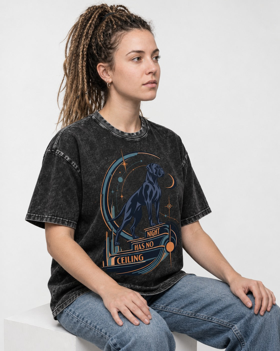 Night Has No Ceiling Boxer Cosmic Graphic Washed Tee in Black, worn by a seated model