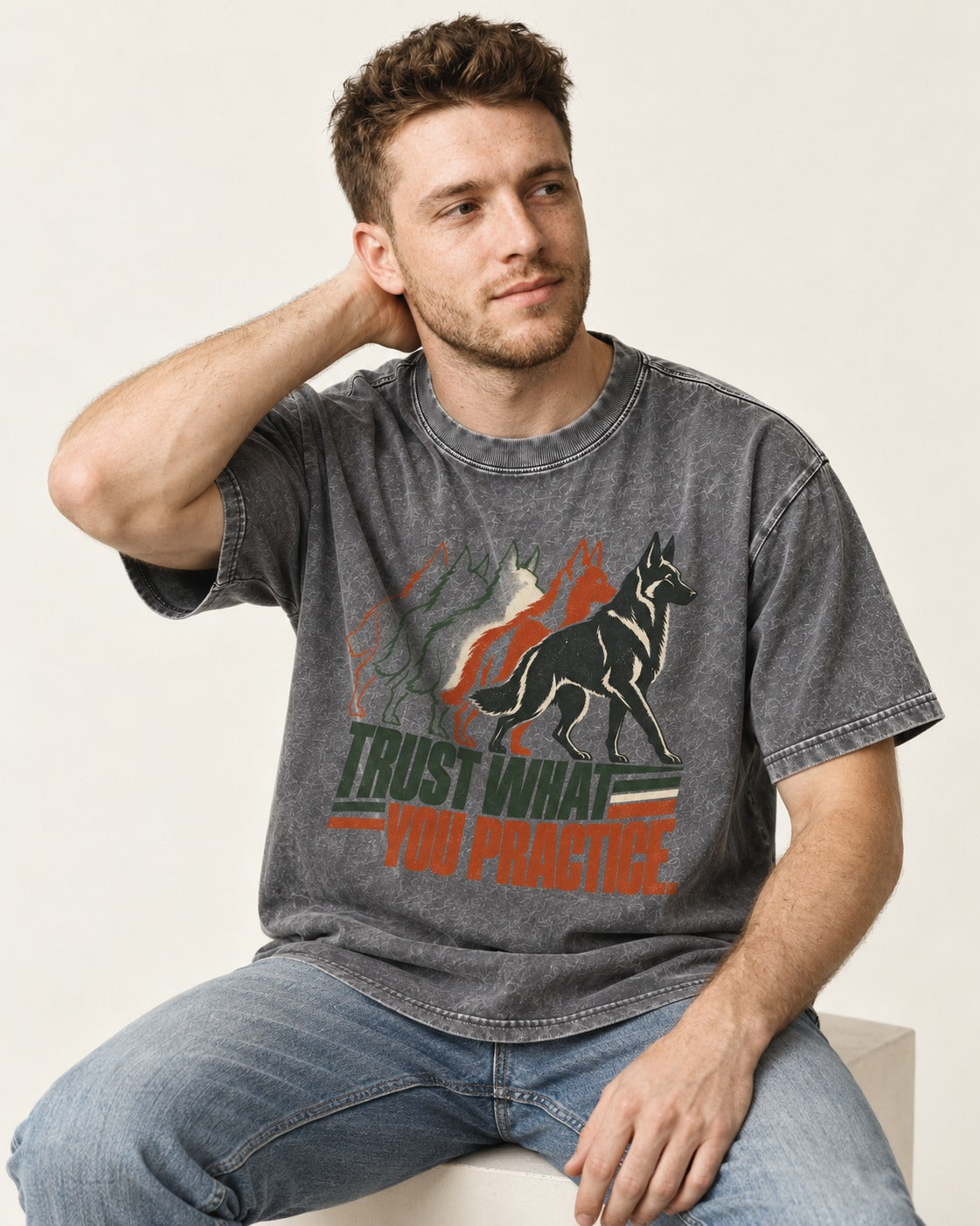 Trust What You Practice German Shepherd Dog Washed Tee in Gray, worn by a seated model