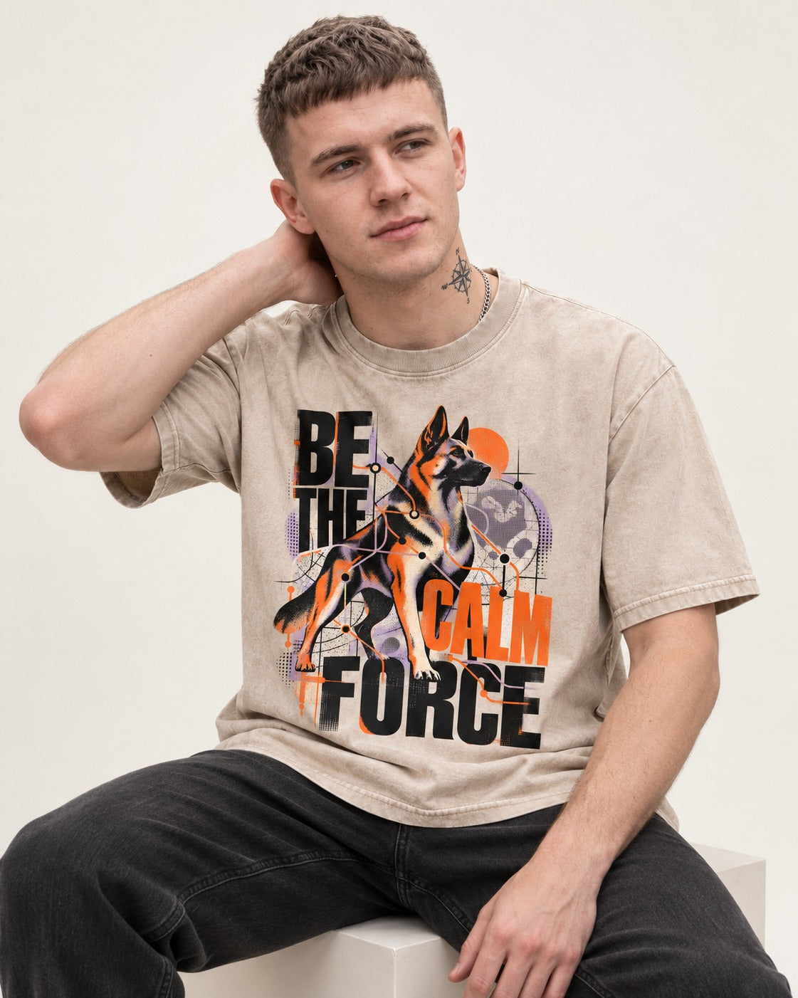 Be the Calm Force German Shepherd Dog Washed Tee in Apricot, worn by a seated model