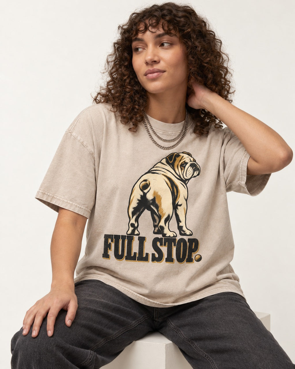 English Bulldog Full Stop Washed Tee in Apricot, worn by a seated model