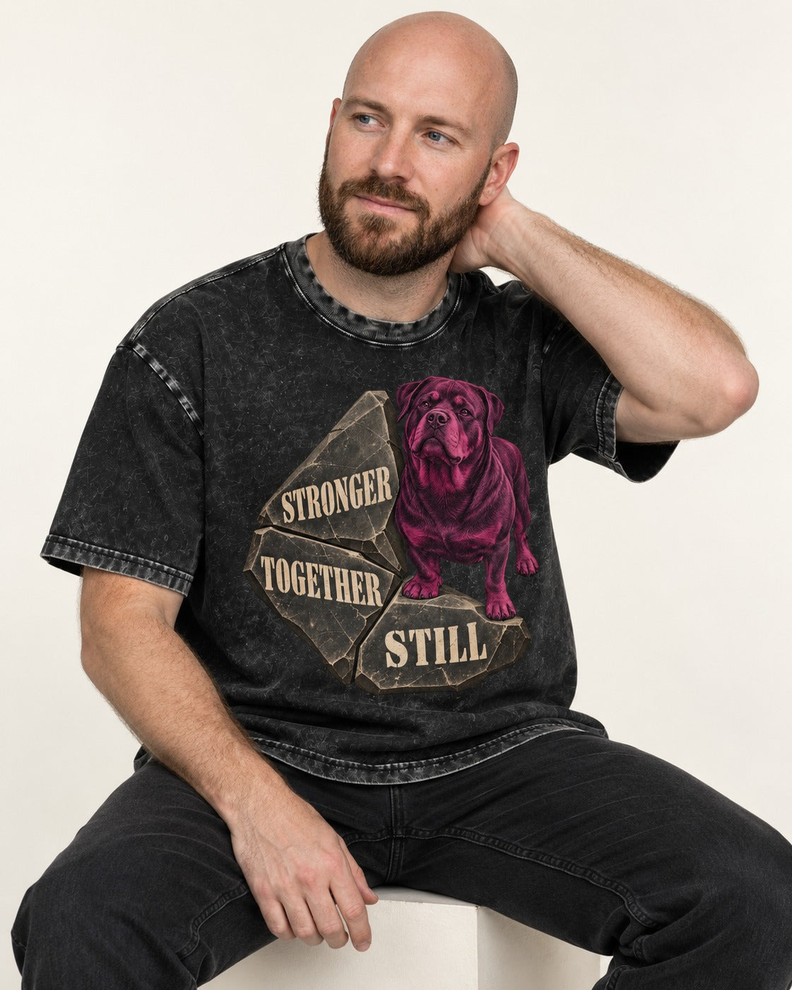 Rottweiler Stronger Together Still Foundation Stone Graphic Washed Tee in Black, worn by a seated model