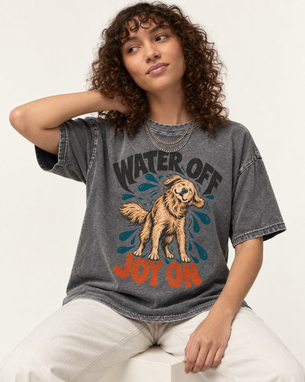 Water Off Joy on Golden Retriever Washed Tee in Gray, worn by a seated model