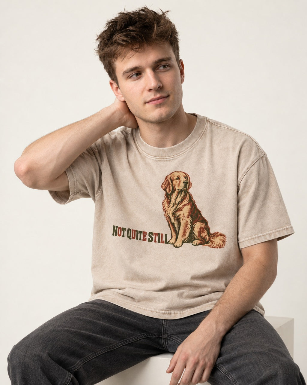 Golden Retriever Not Quite Still Washed Tee in Apricot, worn by a seated model