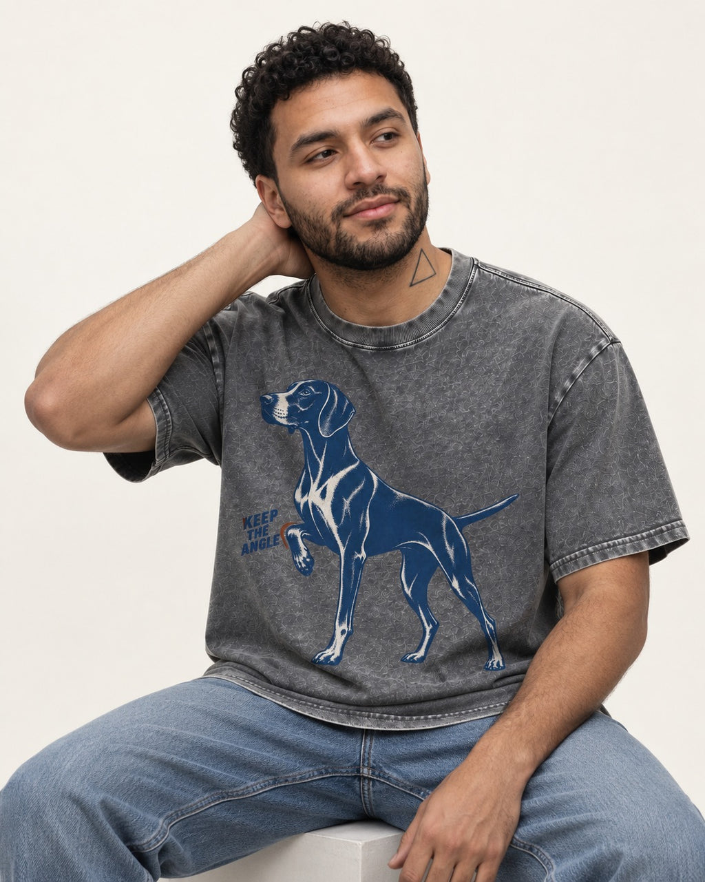 Keep the Angle German Shorthaired Pointer Washed Tee in Gray, worn by a seated model