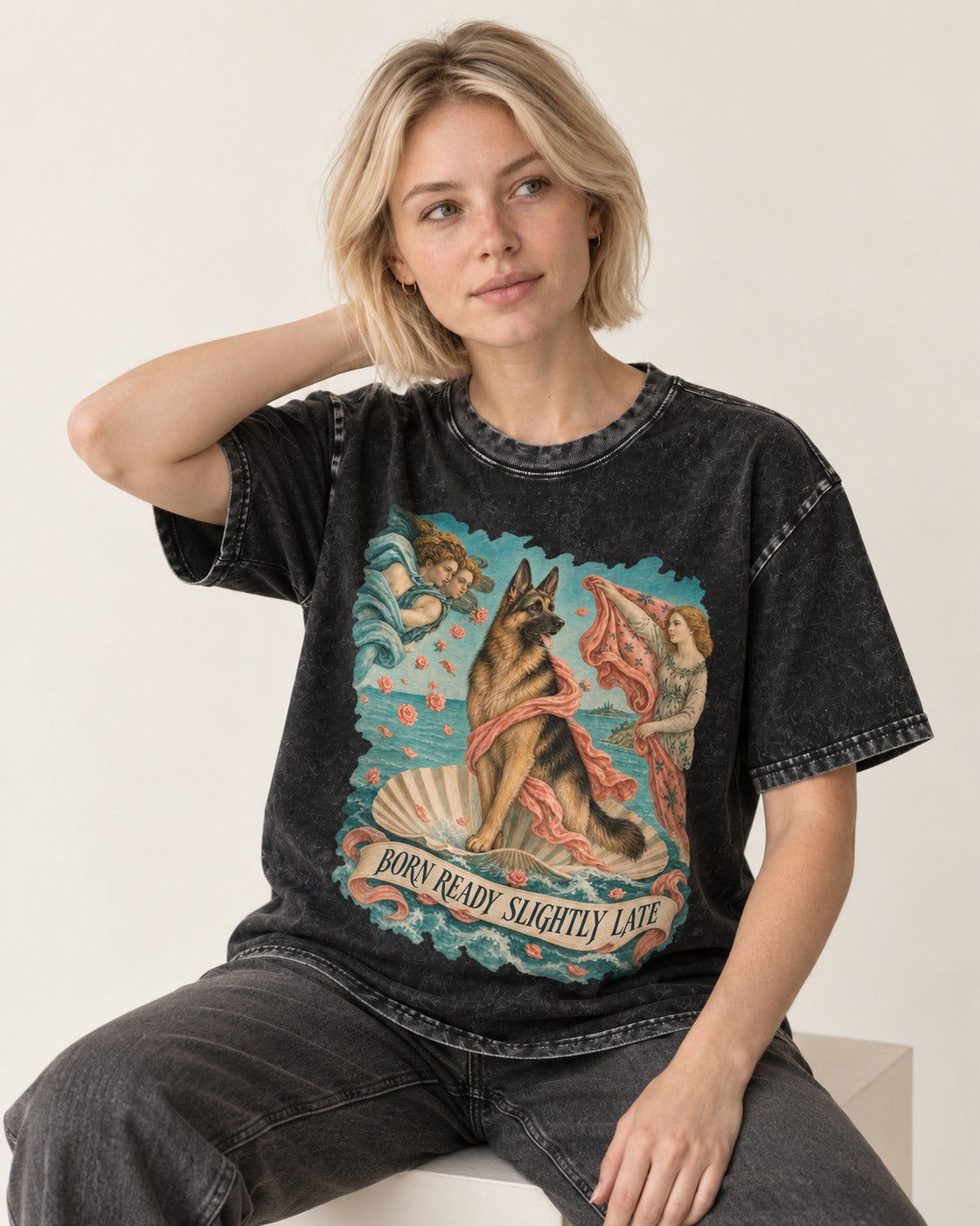 German Shepherd Dog Born Ready Slightly Late Venus Graphic Washed Tee in Black, worn by a seated model