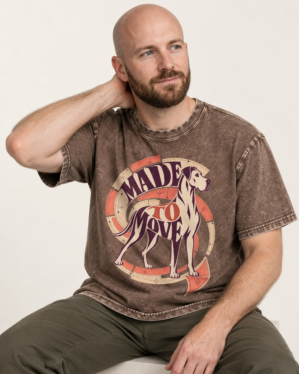 Great Dane Made to Move Washed Tee in Coffee, worn by a seated model