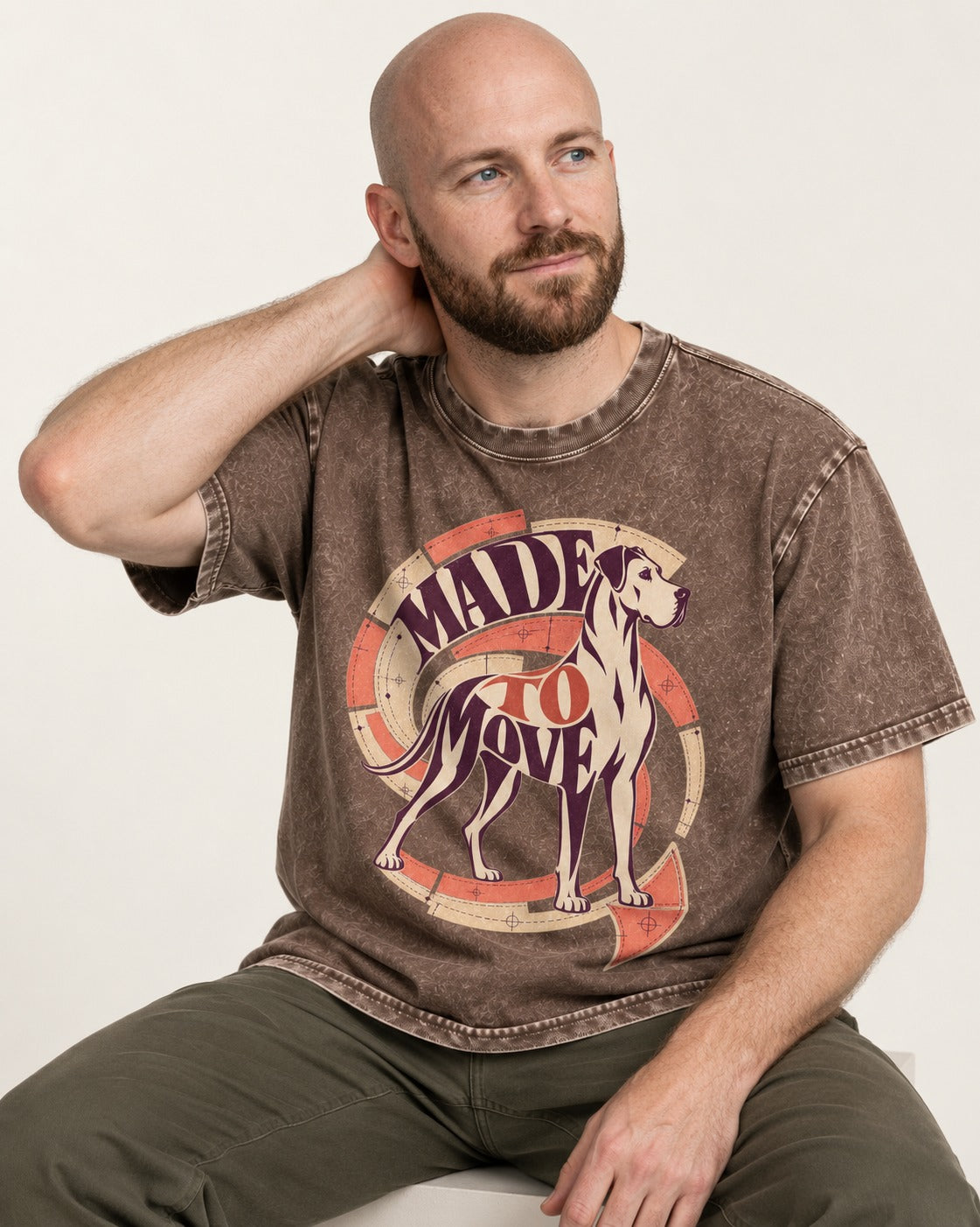 Great Dane Made to Move Washed Tee in Coffee, worn by a seated model