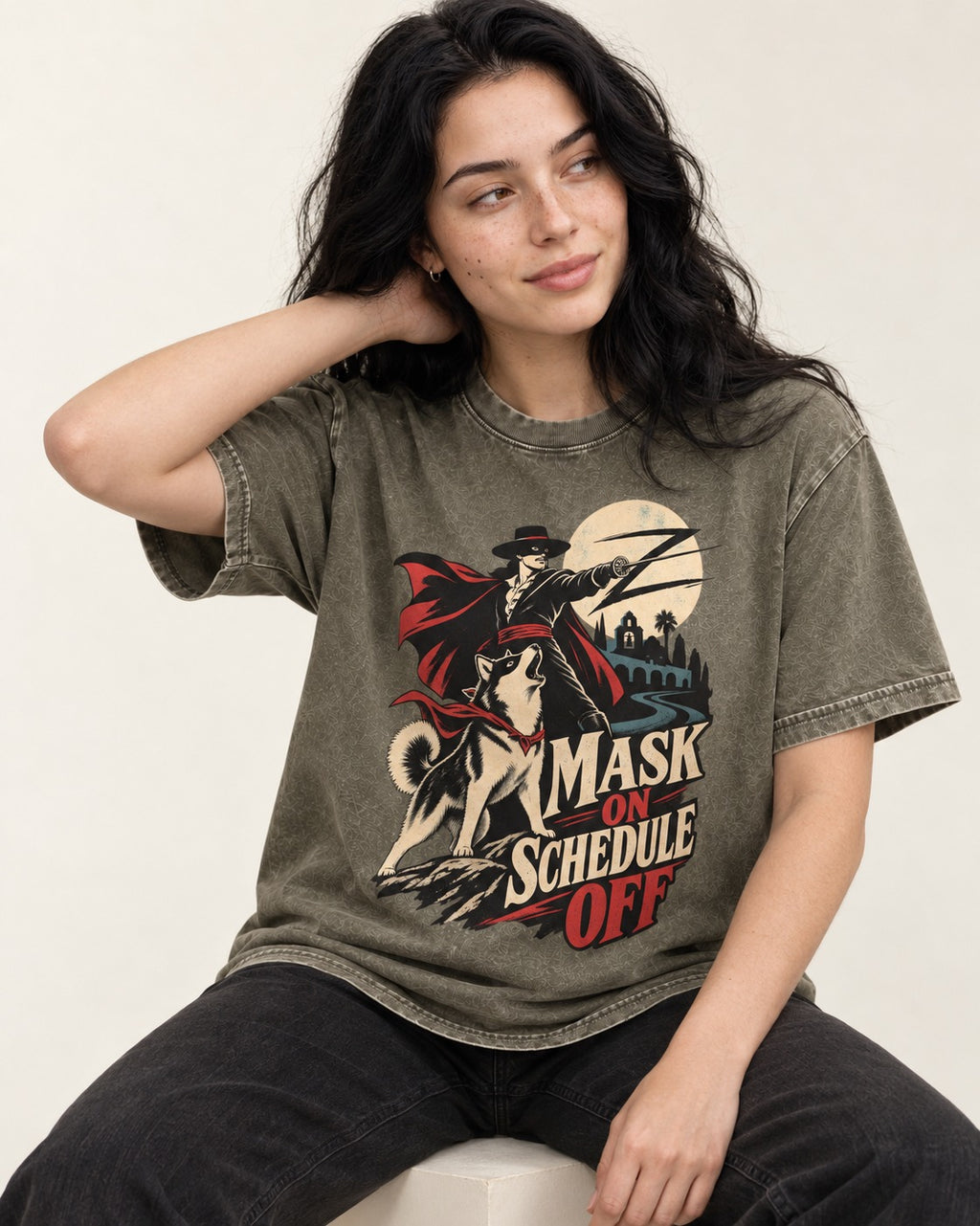 Husky Mask On Schedule Off Masked Swordsman Graphic Washed Tee in Army Green, worn by a seated model