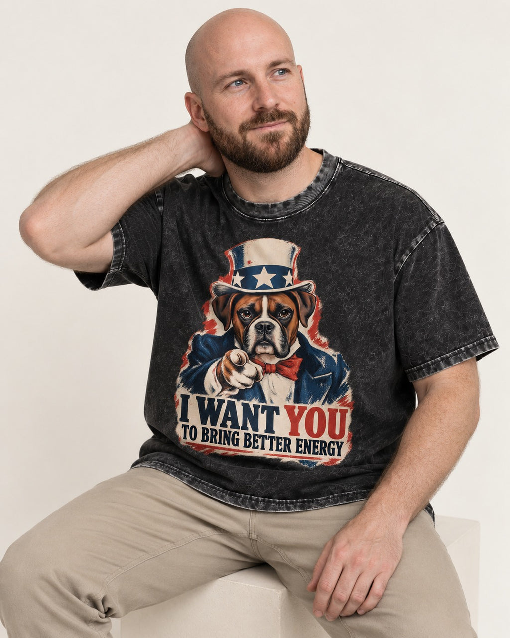 I Want You to Bring Better Energy Boxer Recruitment Poster Graphic Washed Tee in Black, worn by a seated model