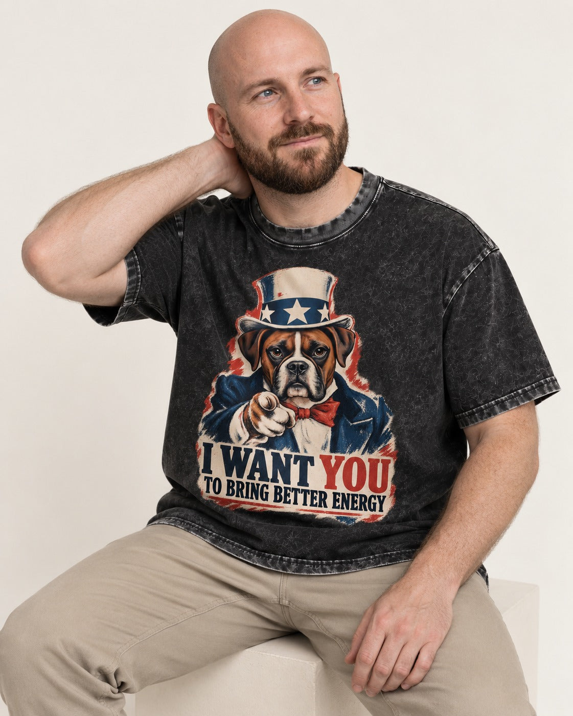 I Want You to Bring Better Energy Boxer Recruitment Poster Graphic Washed Tee in Black, worn by a seated model
