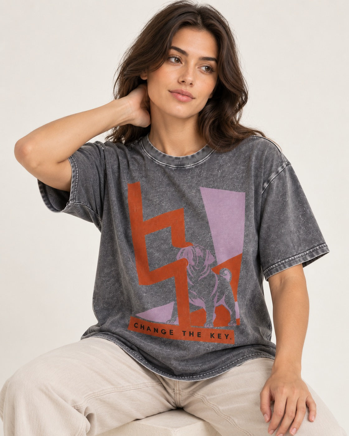 Pug Change the Key Washed Tee in Gray, worn by a seated model