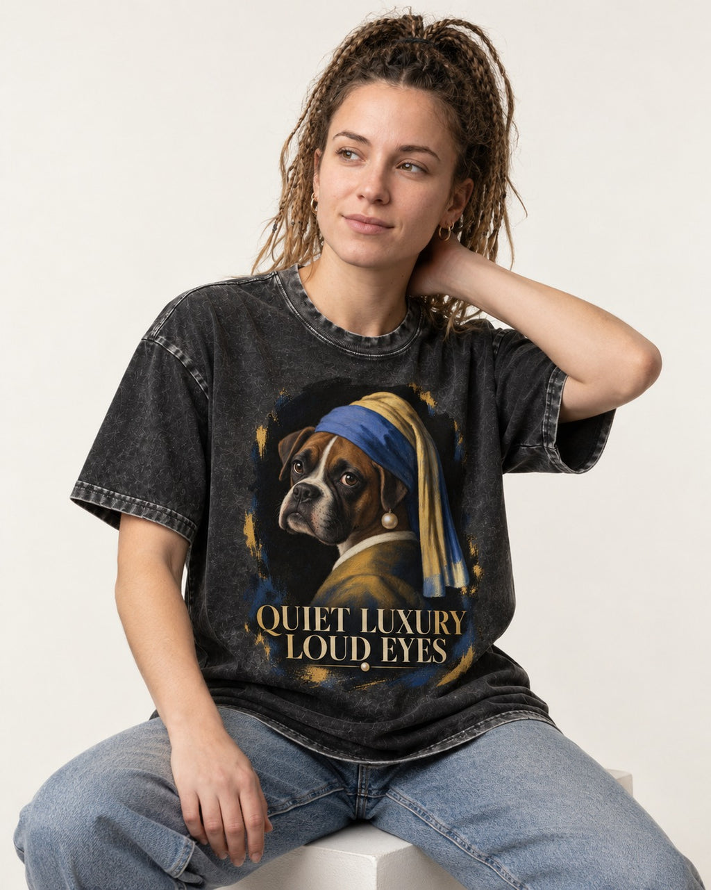Quiet Luxury Loud Eyes Boxer Pearl Portrait Washed Tee in Black, worn by a seated model