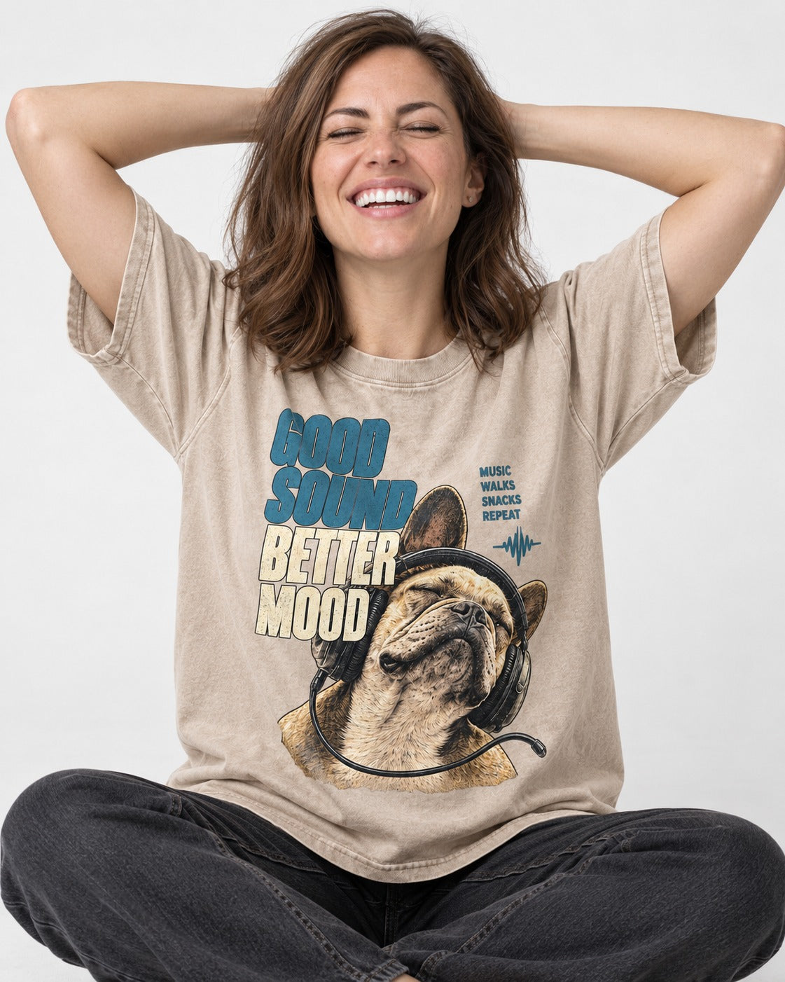 Frenchie Good Sound Better Mood Headphones Graphic Washed Tee in Apricot, worn by a seated model