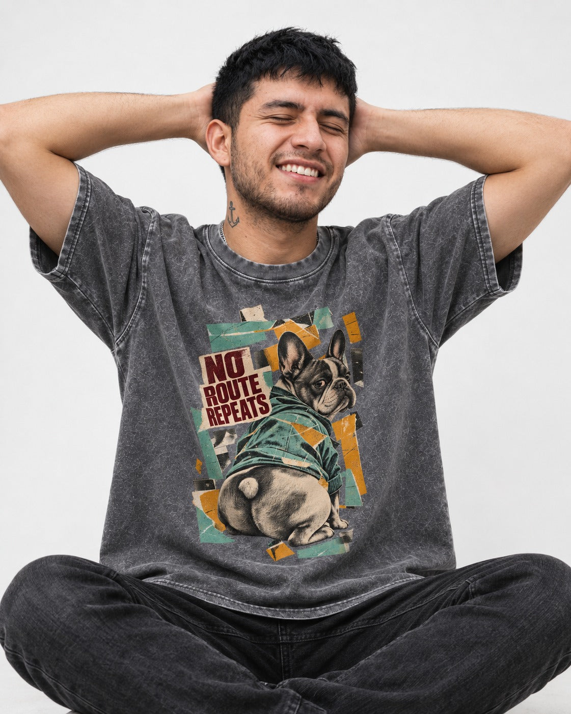 No Route Repeats Frenchie Washed Tee in Gray, worn by a seated model