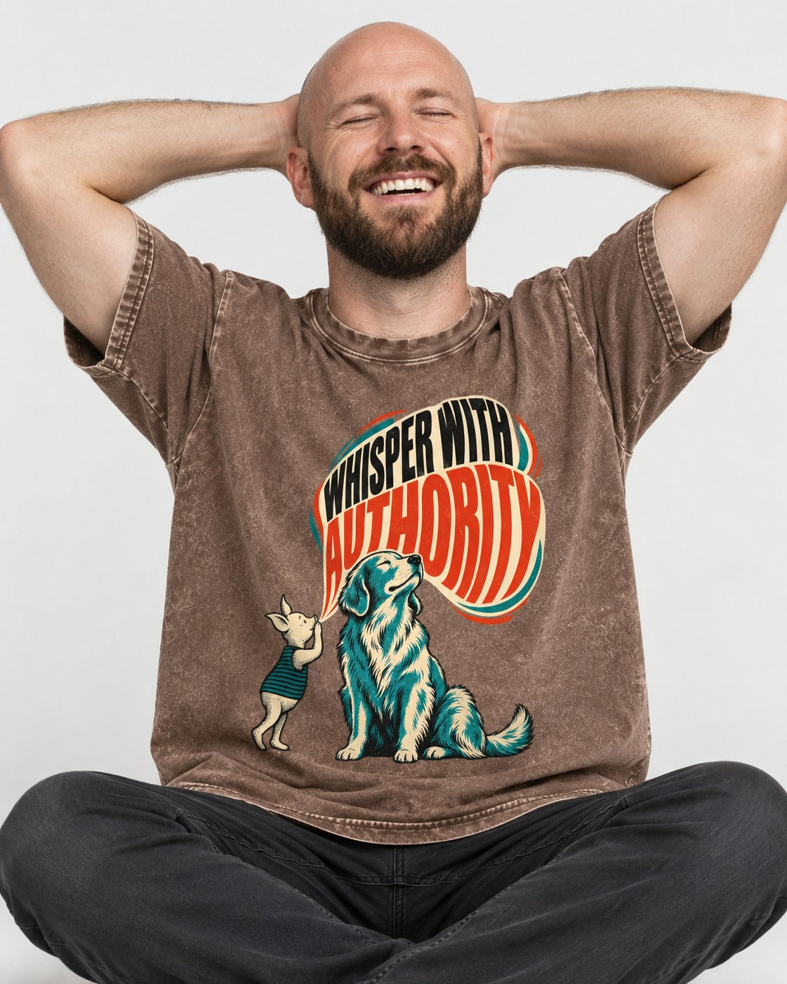 Golden Retriever Whisper with Authority Washed Tee in Coffee, worn by a seated model