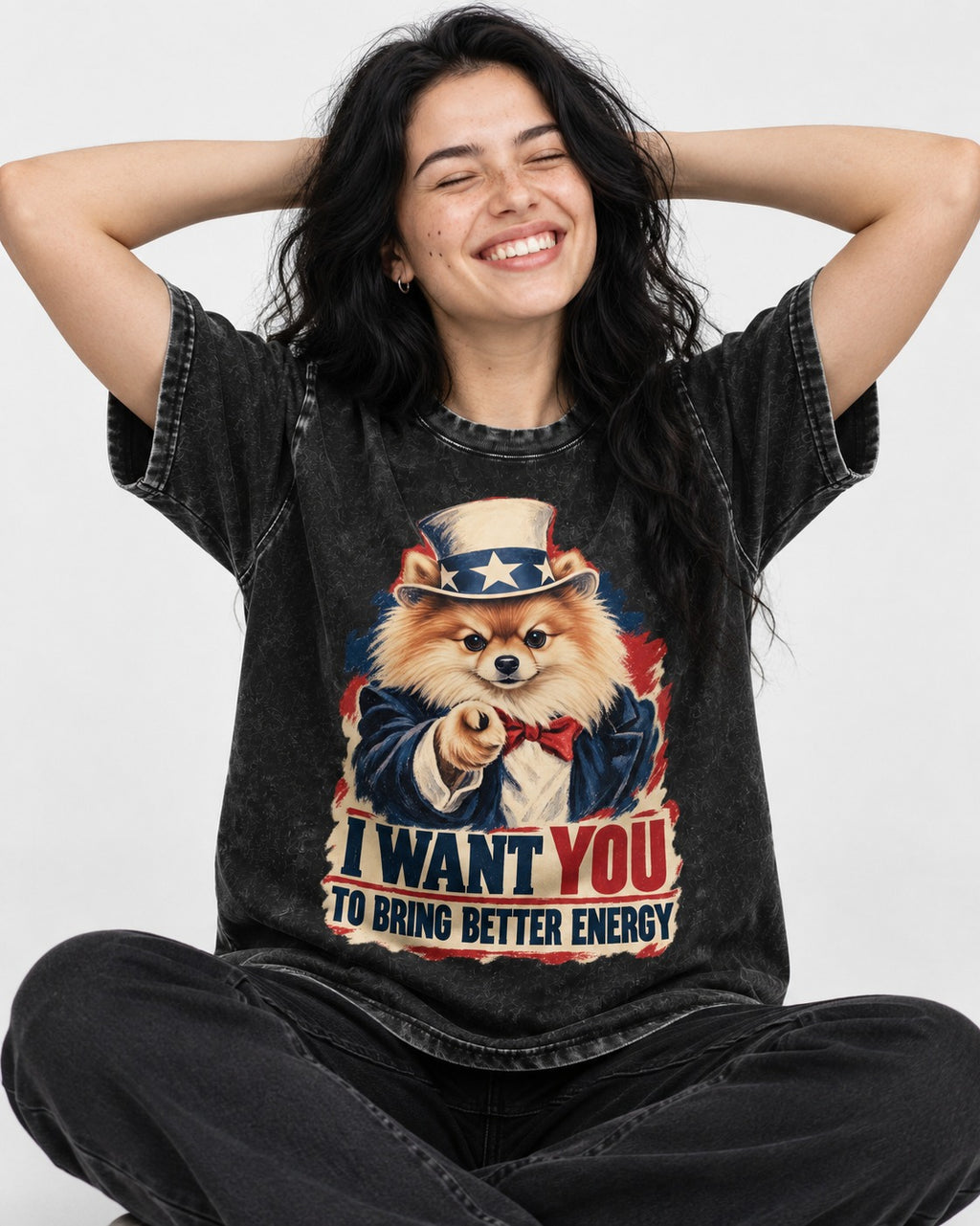 Pomeranian I Want You to Bring Better Energy Uncle Sam Graphic Washed Tee in Black, worn by a seated model