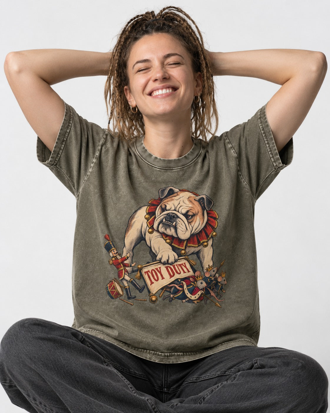 English Bulldog Toy Duty Nutcracker Mice Washed Tee in Army Green, worn by a seated model