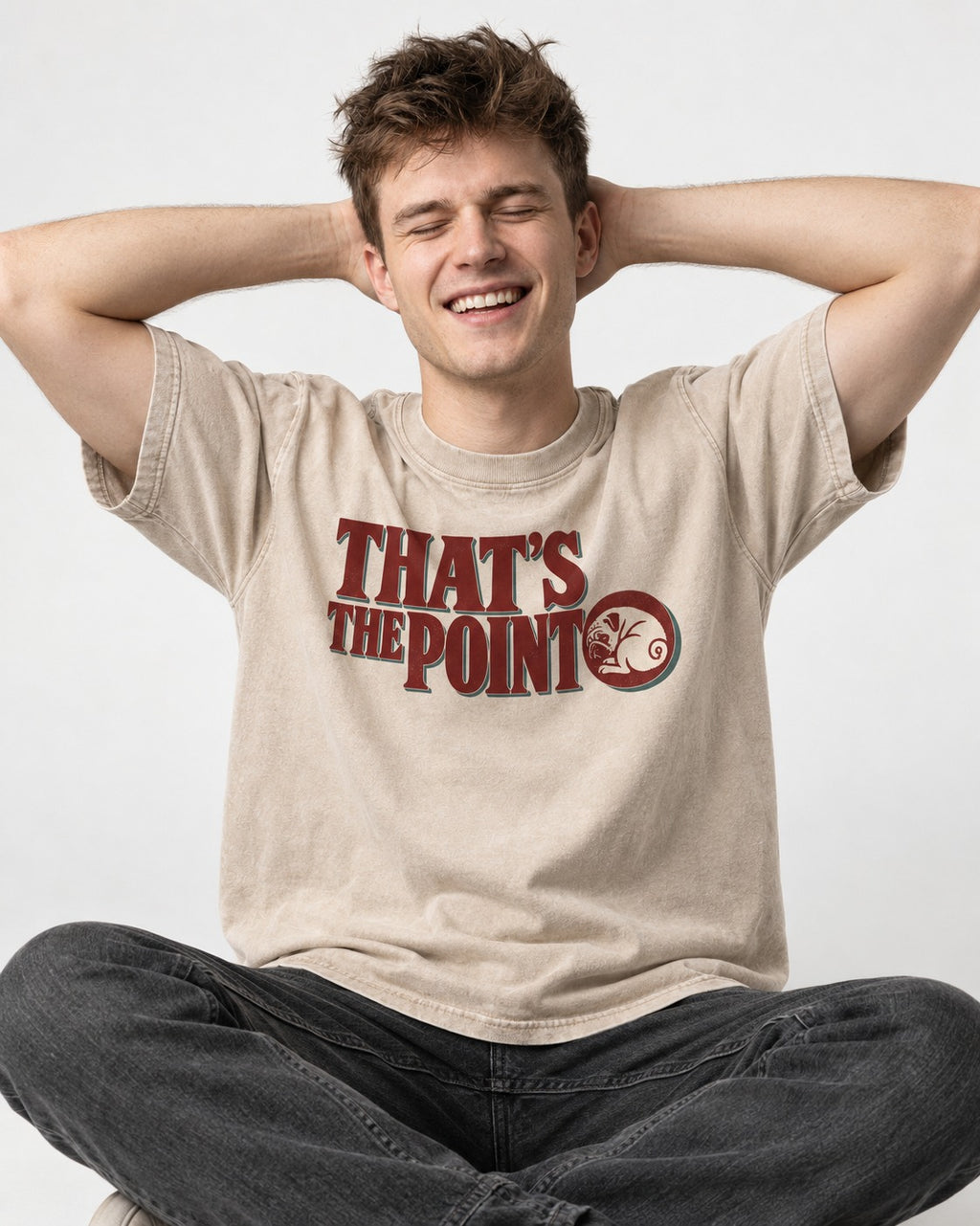 Pug's the Point Washed Tee in Apricot, worn by a seated model