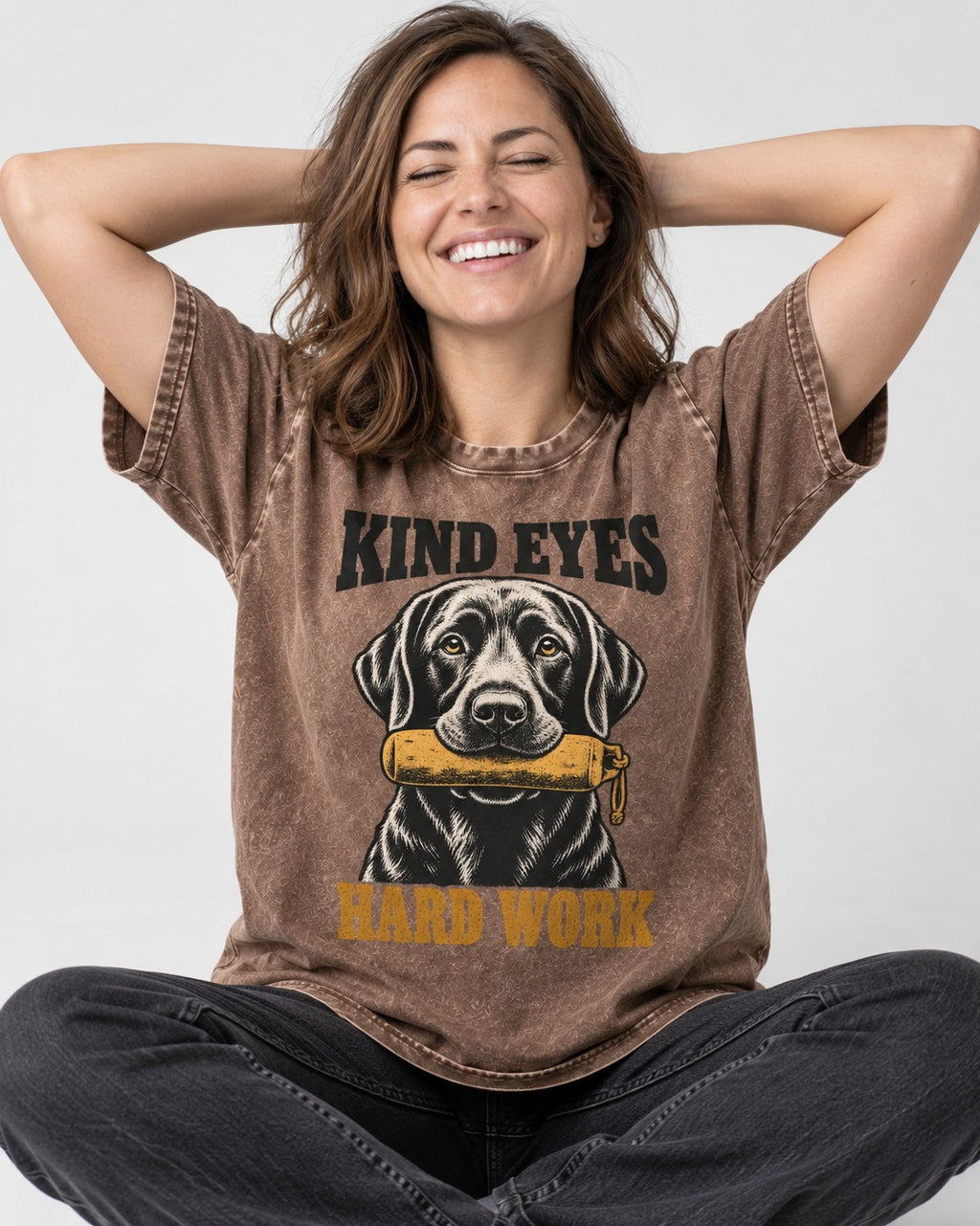 Kind Eyes Hard Work Labrador Retriever Washed Tee in Coffee, worn by a seated model