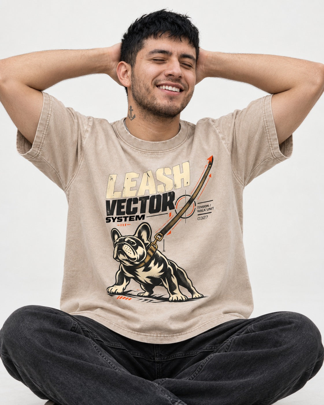 Frenchie Leash Vector Washed Tee in Apricot, worn by a seated model