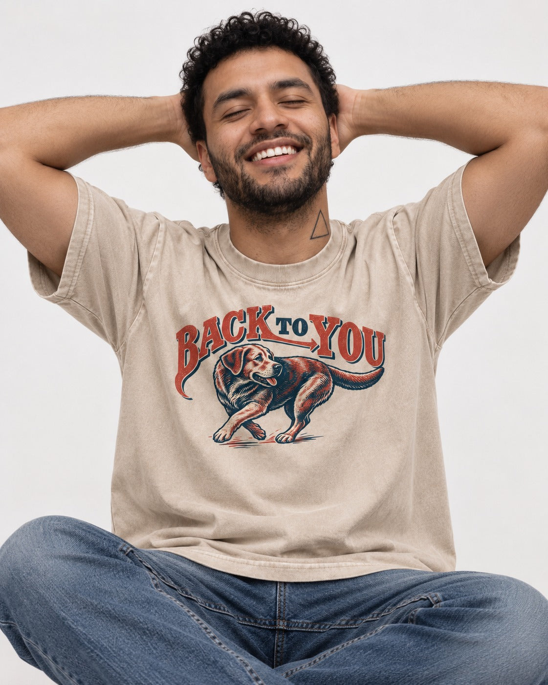 Labrador Retriever Back to You Turning Graphic Washed Tee in Apricot, worn by a seated model