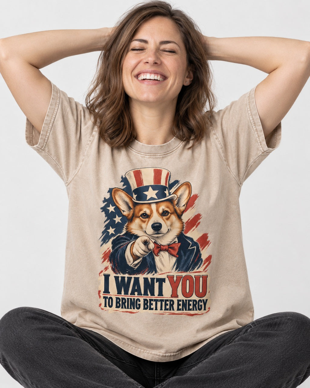 Corgi I Want You to Bring Better Energy Uncle Sam Washed Tee in Apricot, worn by a seated model