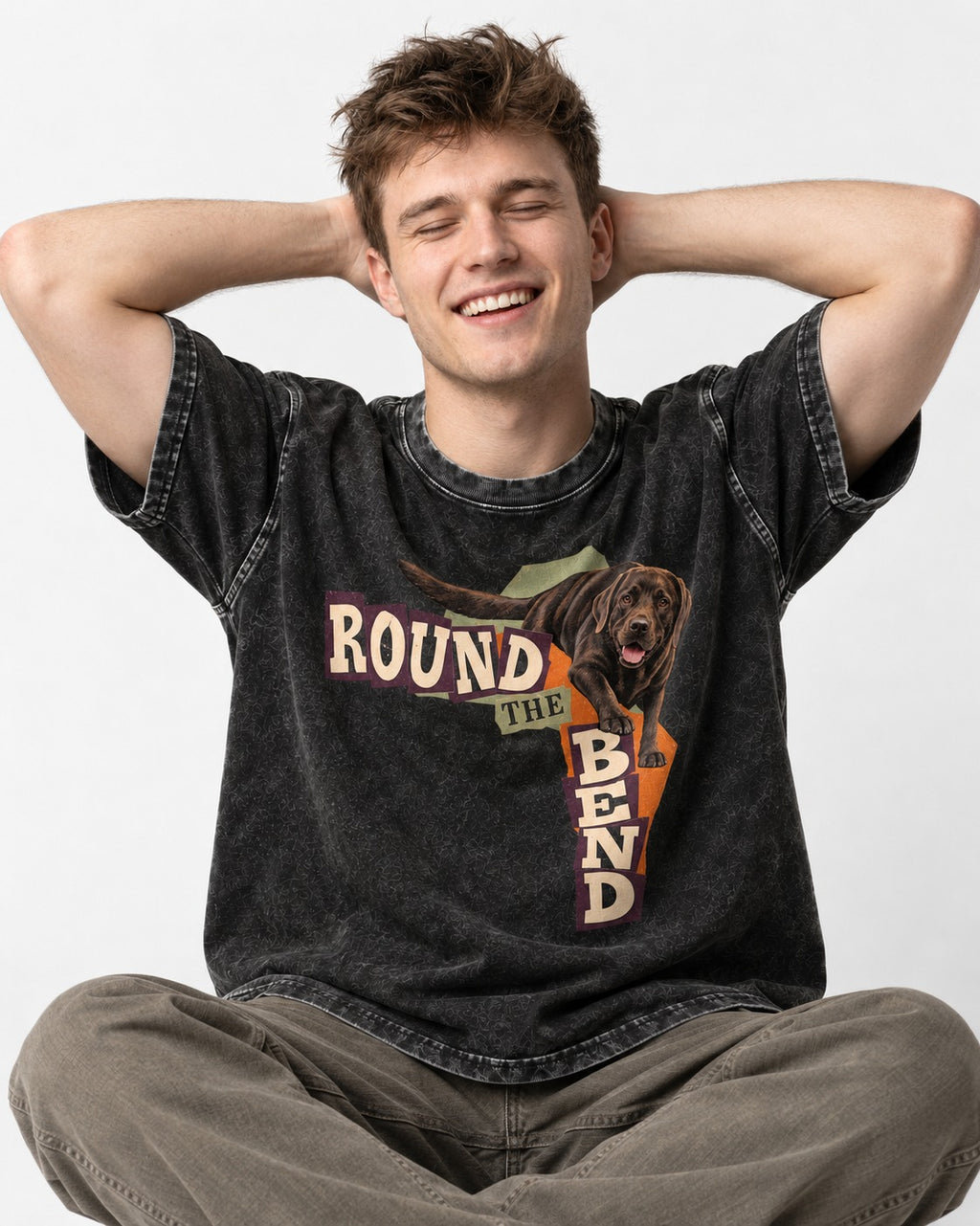 Labrador Retriever Round the Bend Collage Graphic Washed Tee in Black, worn by a seated model
