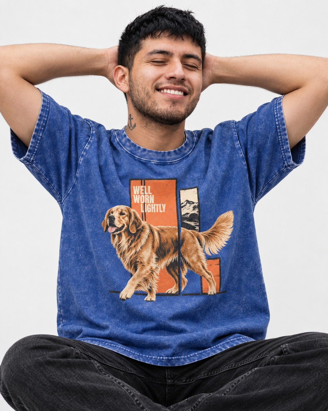 Golden Retriever Well Worn Lightly Mountain Graphic Washed Tee in Royal Blue, worn by a seated model