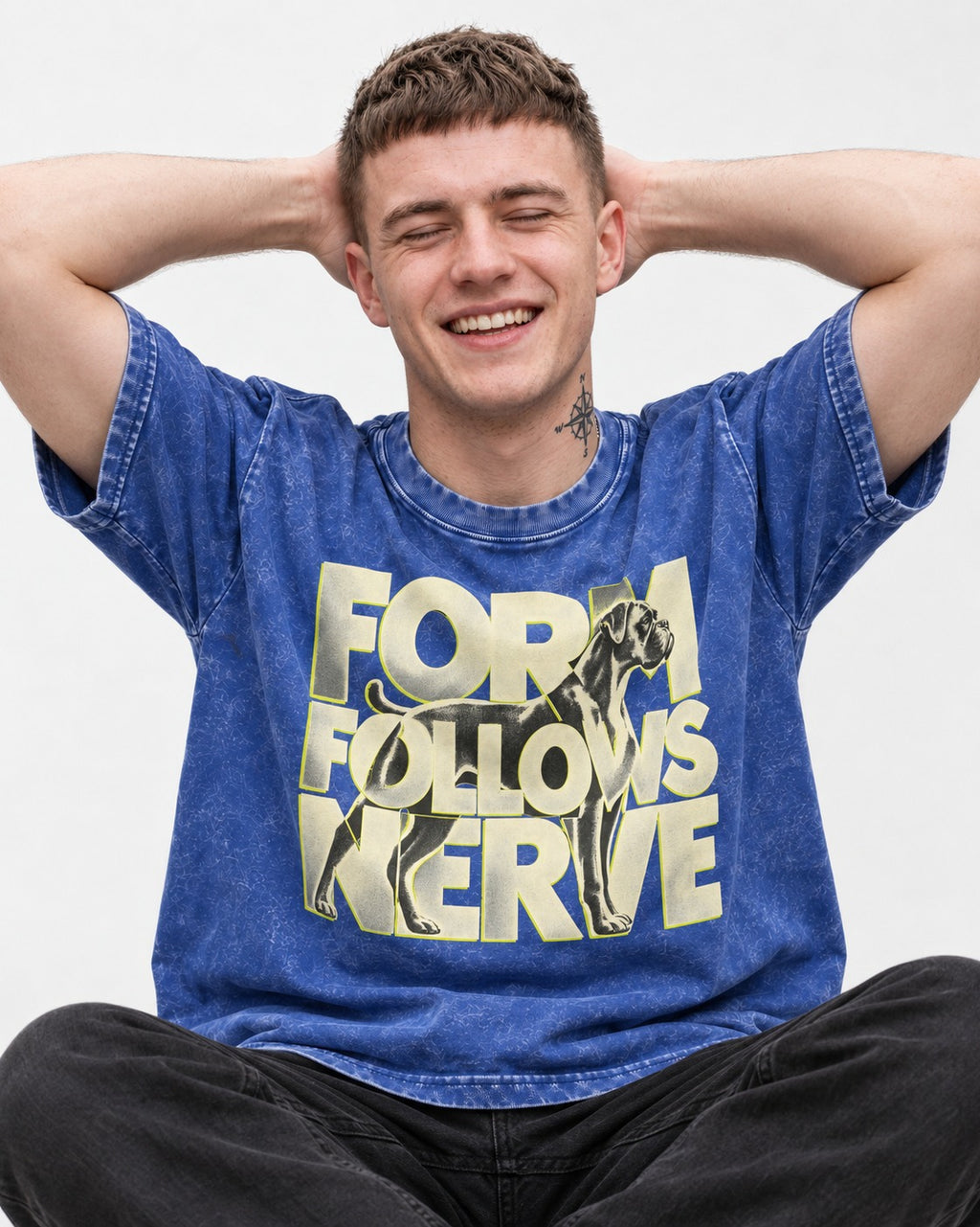 Form Follows Nerve Boxer Typography Washed Tee in Royal Blue, worn by a seated model