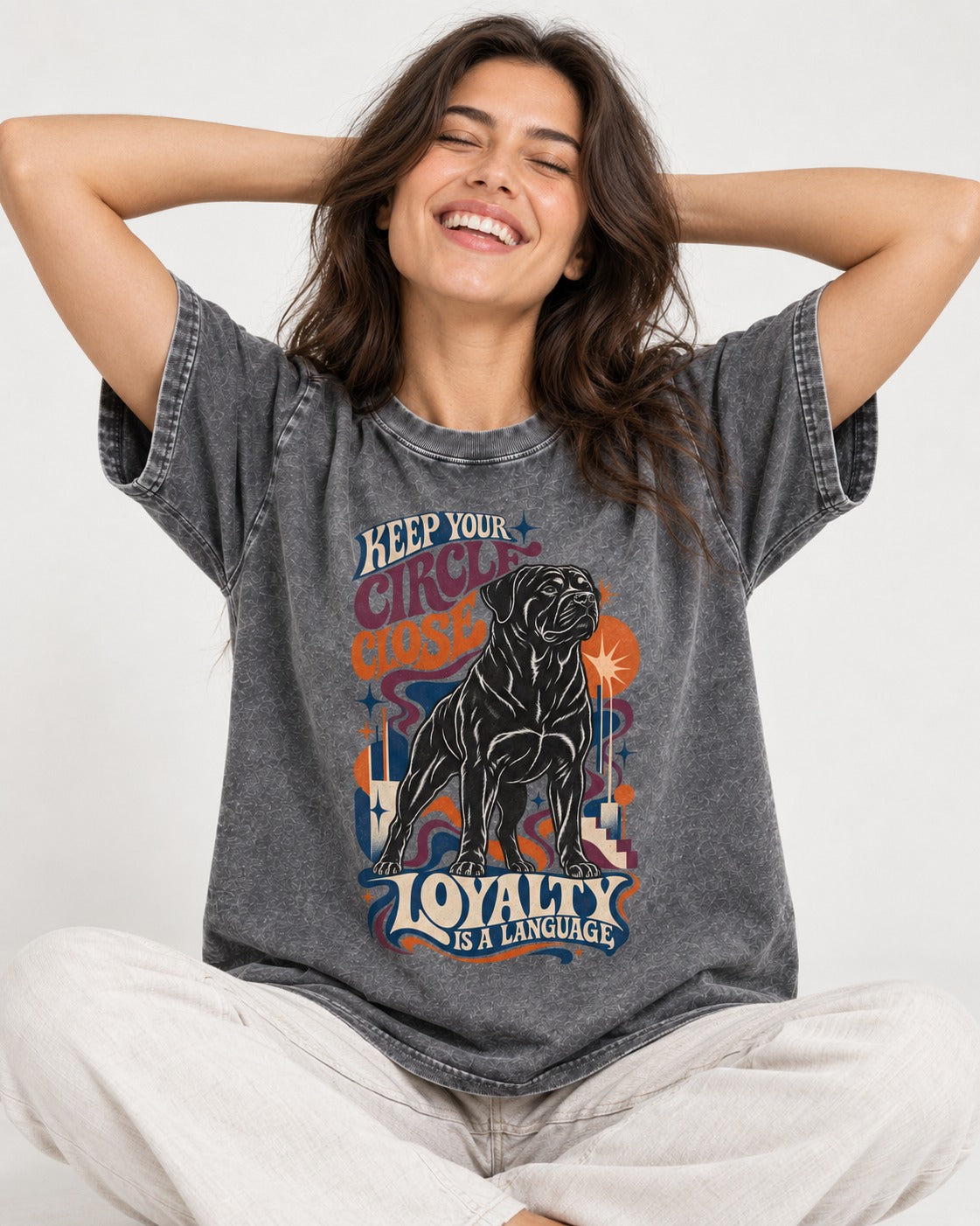 Keep Your Rottweiler Circle Close Washed Tee in Gray, worn by a seated model