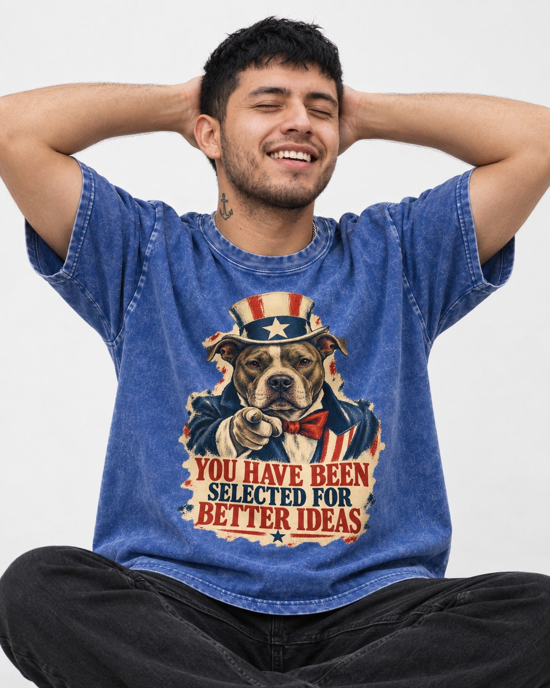 Pitbull You Have Been Selected for Better Ideas Uncle Sam Graphic Washed Tee in Royal Blue, worn by a seated model