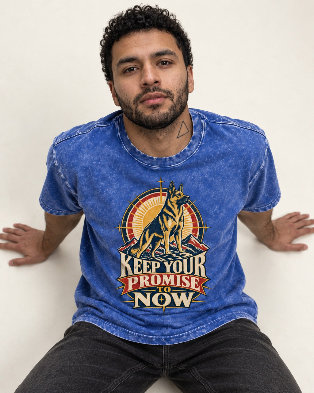 Keep Your Promise To Now Sunrise German Shepherd Dog Graphic Washed Tee in Royal Blue, worn by a seated model