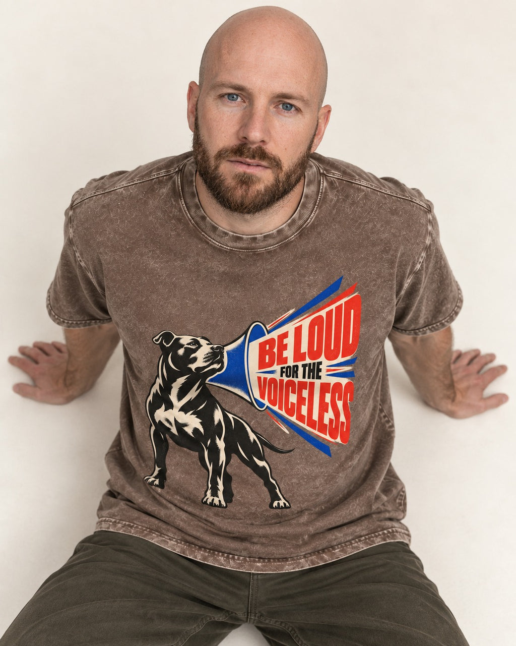 Pitbull For the Voiceless Washed Tee in Coffee, worn by a seated model