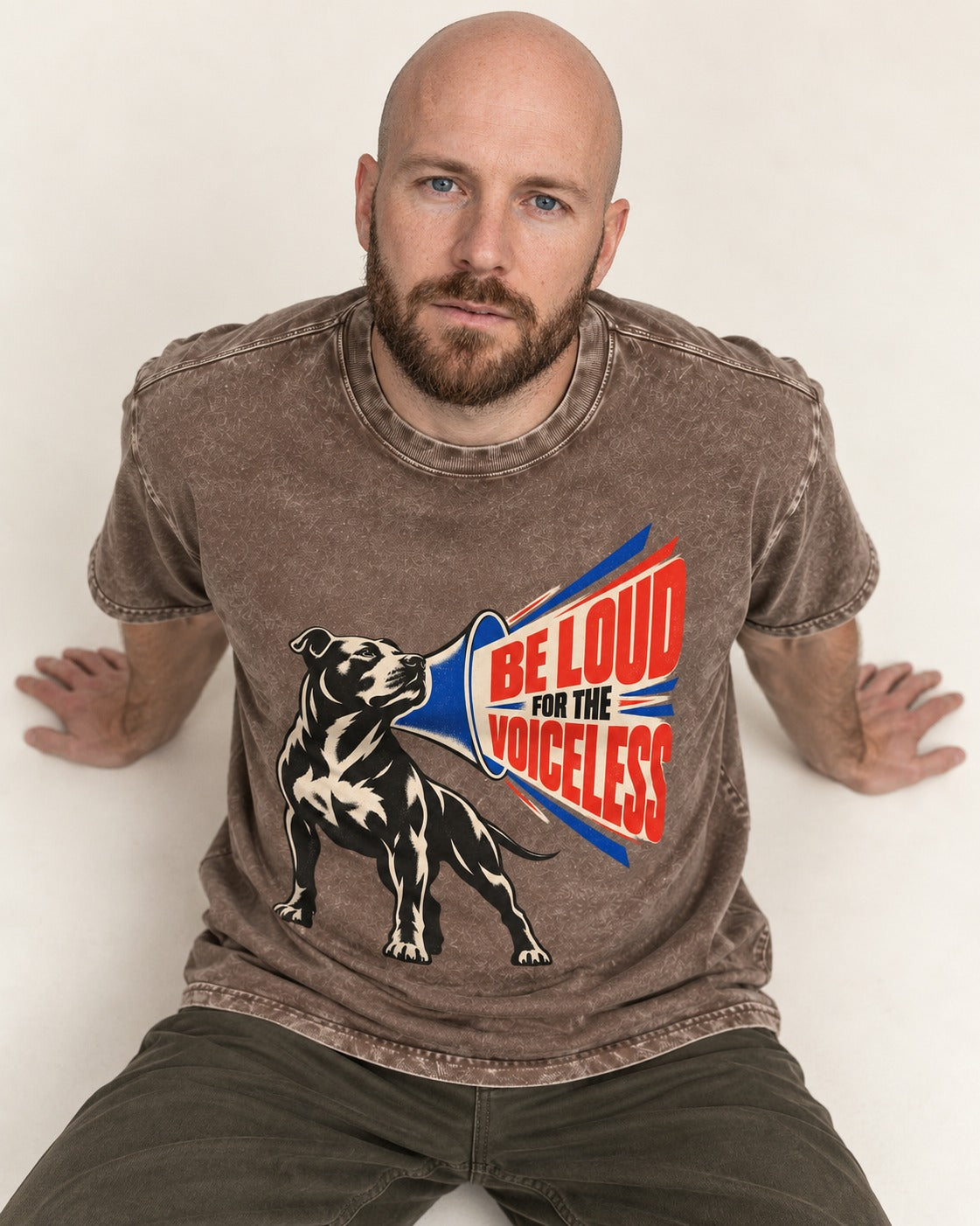 Pitbull For the Voiceless Washed Tee in Coffee, worn by a seated model