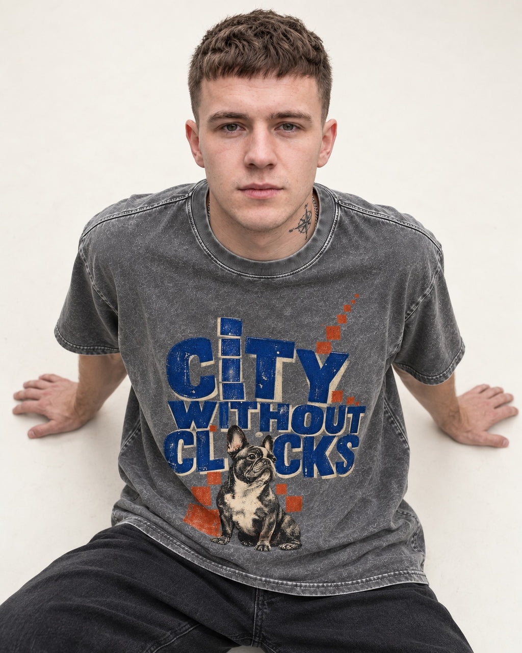 Frenchie's City Without Clocks Washed Tee in Gray, worn by a seated model