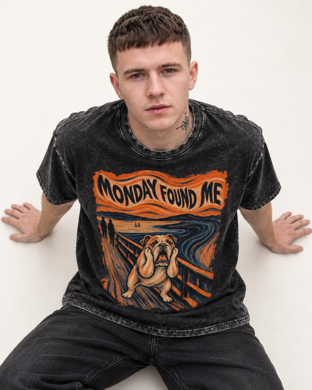English Bulldog Monday Found Me Scream Graphic Washed Tee in Black, worn by a seated model