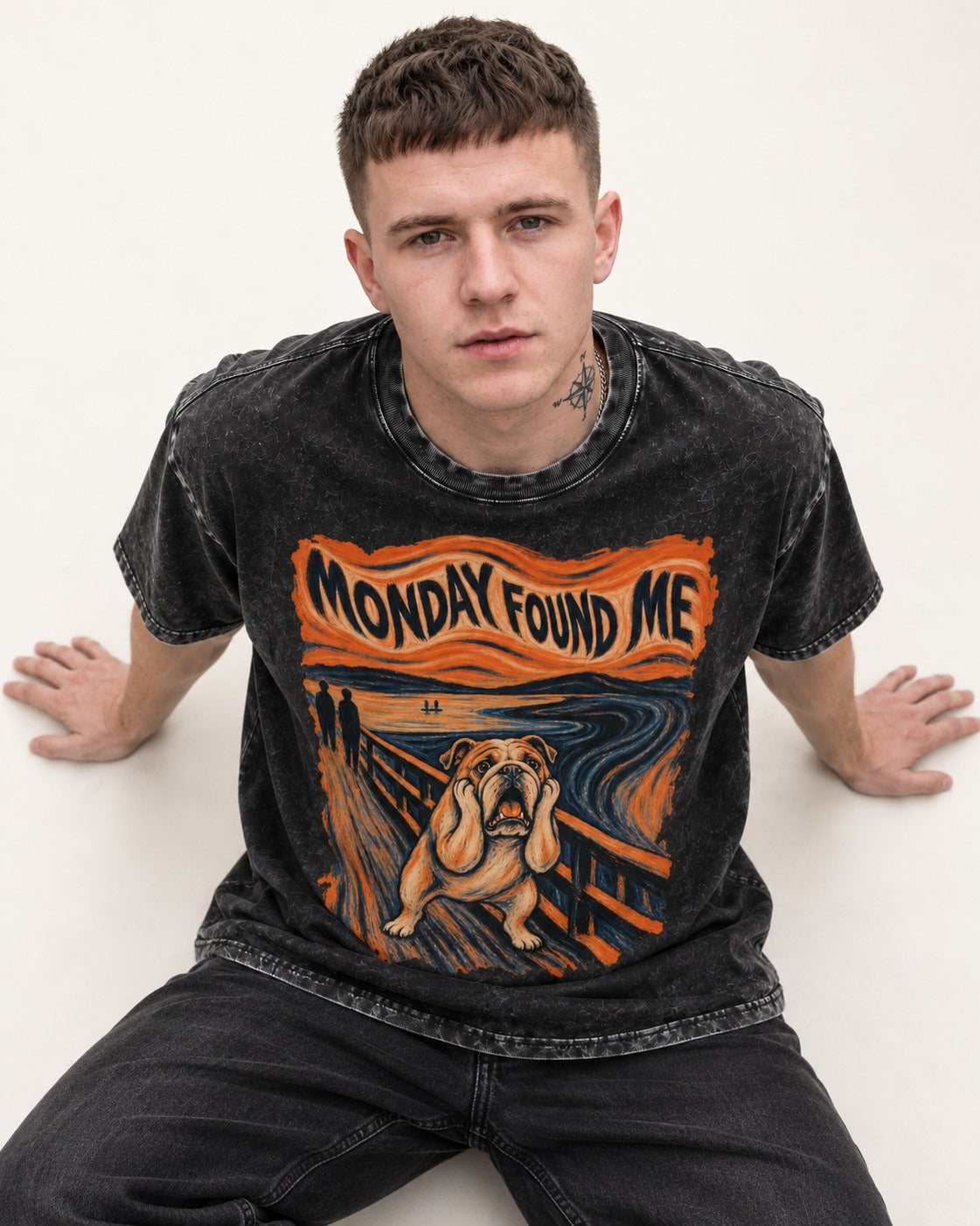 English Bulldog Monday Found Me Scream Graphic Washed Tee in Black, worn by a seated model