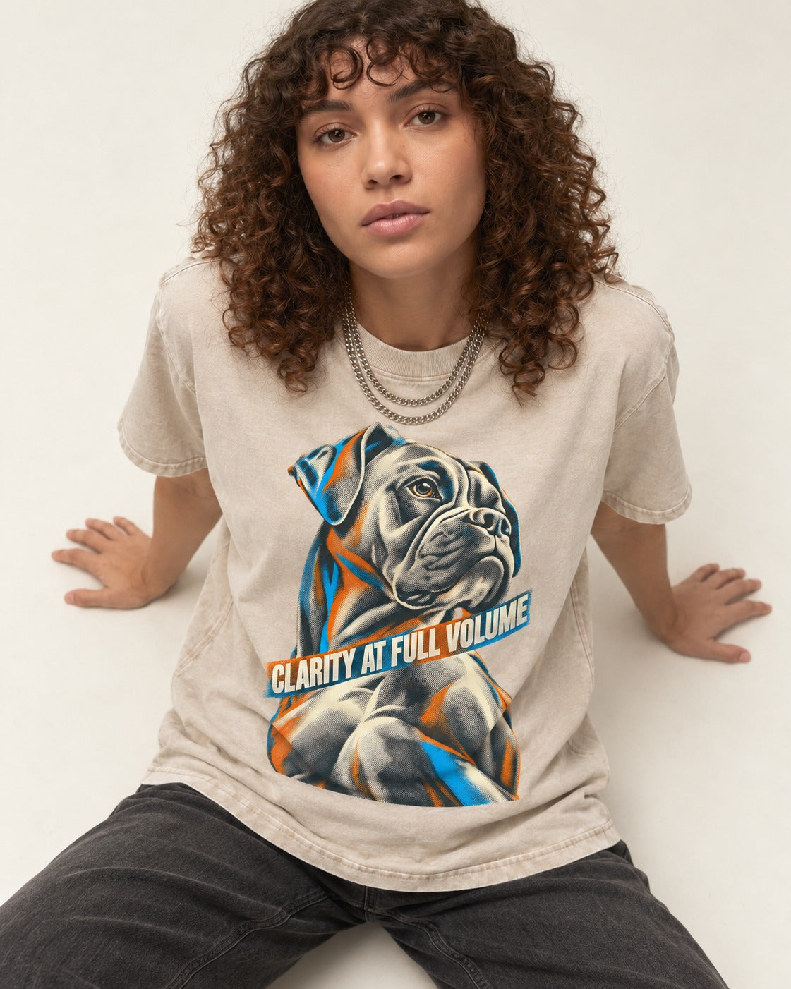 Clarity at Full Volume Boxer Portrait Washed Tee in Apricot, worn by a seated model