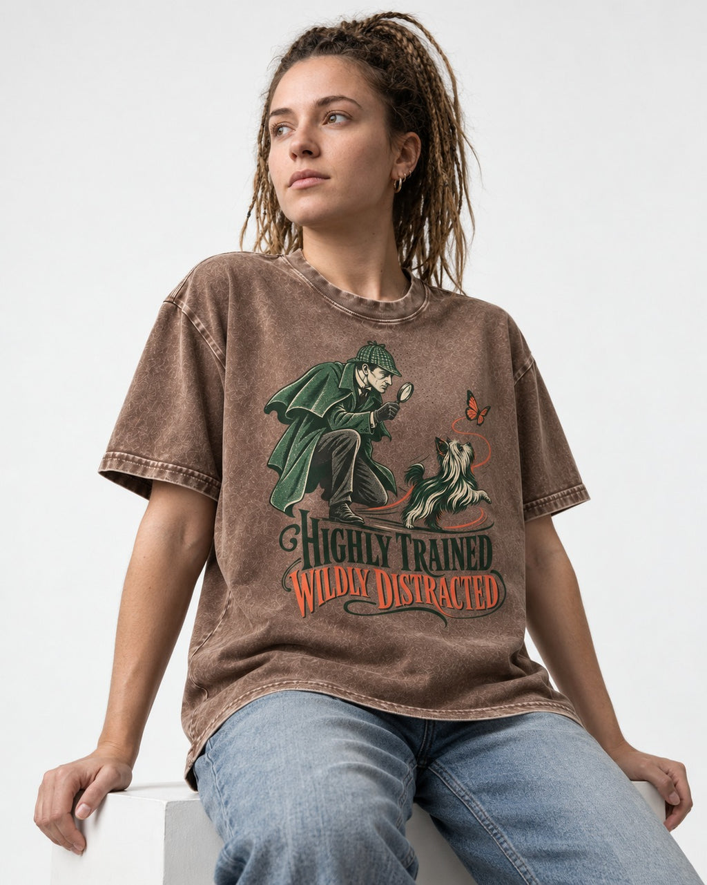 Highly Trained Wildly Distracted Yorkshire Terrier Washed Tee in Coffee, worn by a seated model