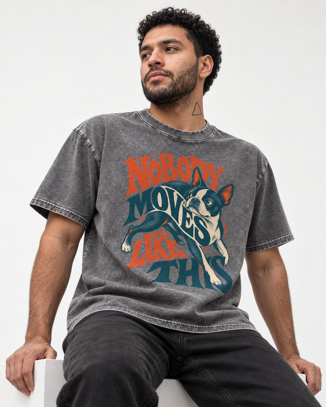 Nobody Moves Like This Boston Terrier Washed Tee in Gray, worn by a seated model