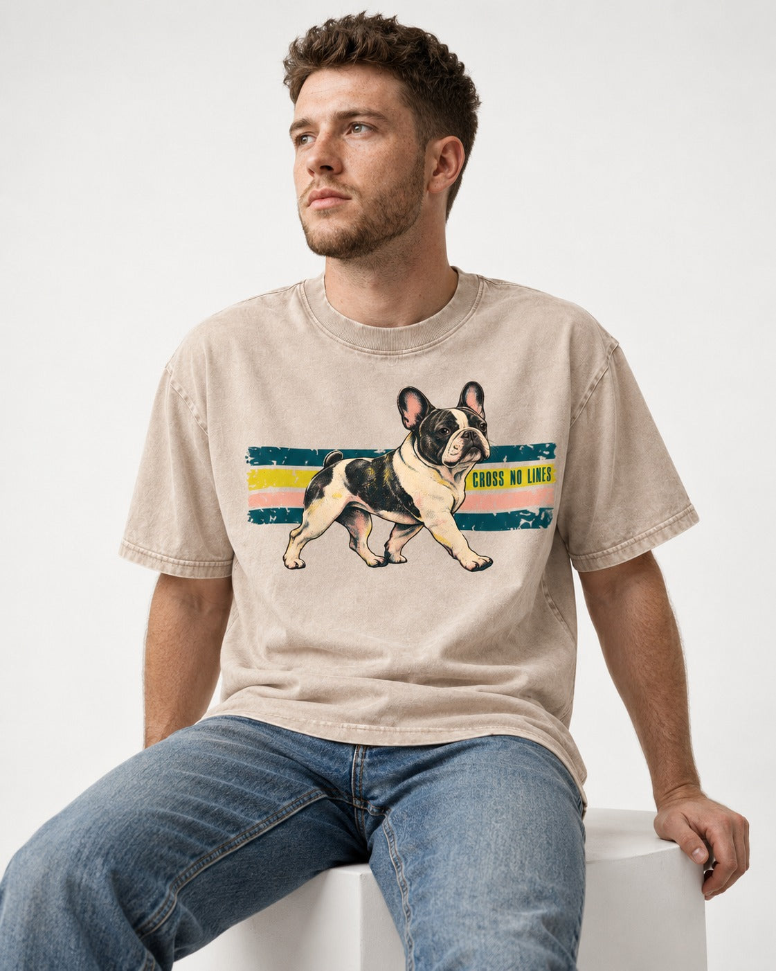 Frenchie Cross No Lines Washed Tee in Apricot, worn by a seated model