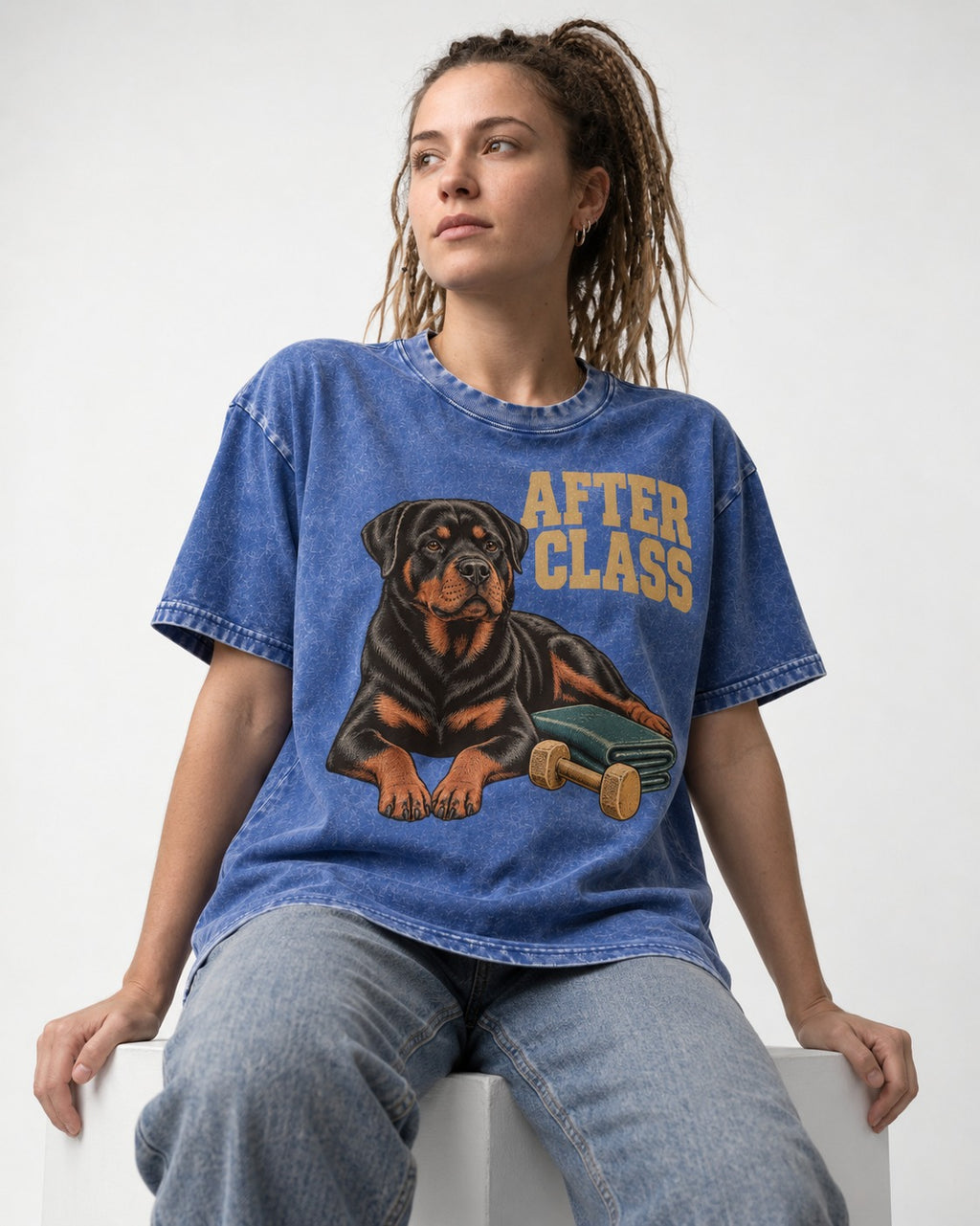 Rottweiler After Class Books and Dumbbell Graphic Washed Tee in Royal Blue, worn by a seated model