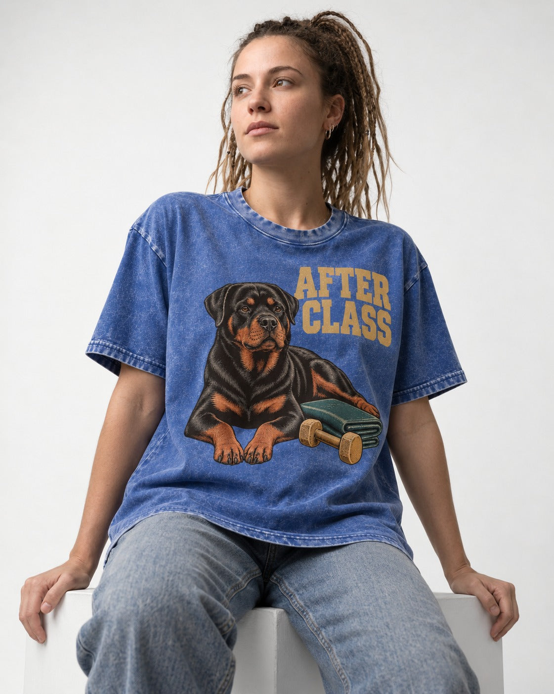 Rottweiler After Class Books and Dumbbell Graphic Washed Tee in Royal Blue, worn by a seated model
