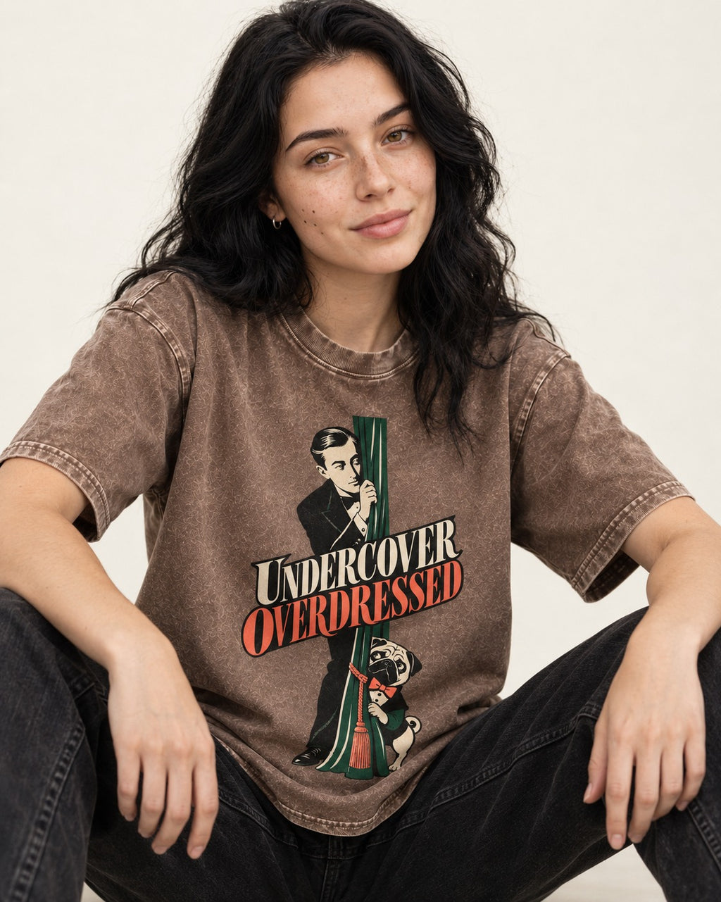 Undercover Overdressed Pug Washed Tee in Coffee, worn by a seated model