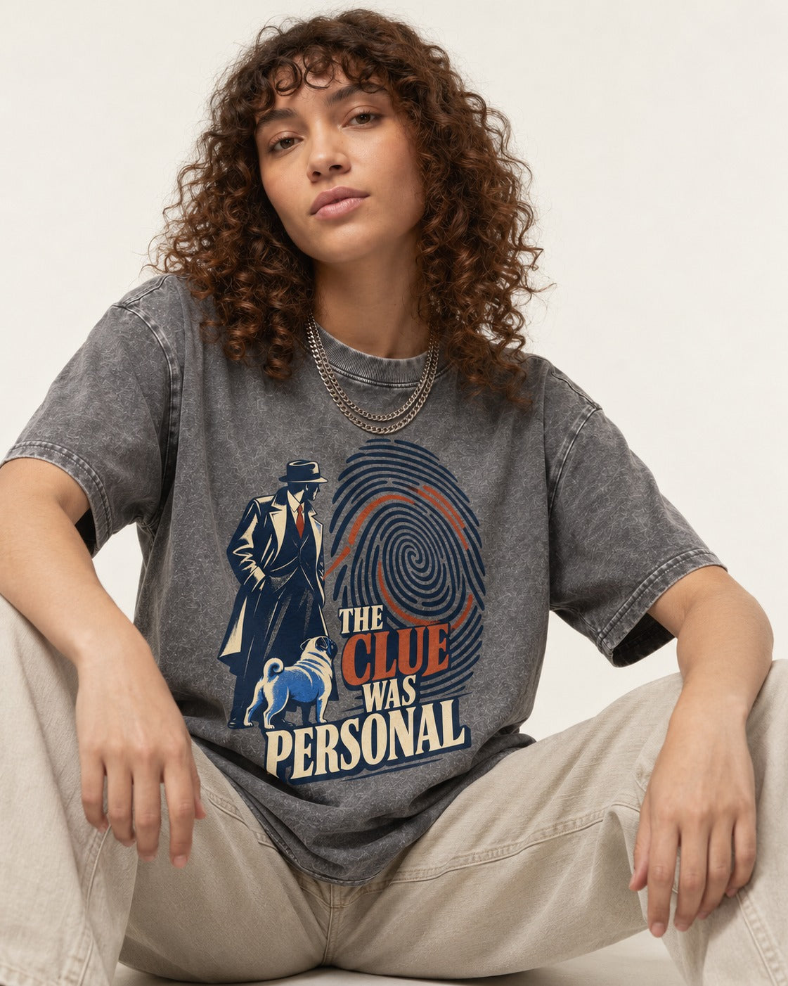 The Pug Clue Was Personal Washed Tee in Gray, worn by a seated model